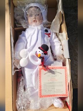 Porcelain Baby Doll in White Plush Snowman Outfit
